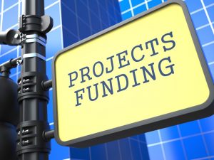 Projects Funding. Signpost on Blue Background of a Modern Building. - How to Sell Event Sponsorship Packages